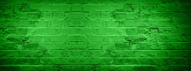 Green damaged rustic brick wall texture banner panorama, colorful trend color 2020 germany