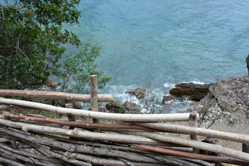 Fototapeta na wymiar wooden fence over the sea