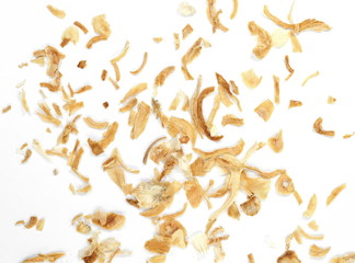 Fototapeta na wymiar Dried Minced Onions on a White Background. Onion flakes isolated on white background.