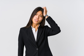 Young asian business woman tired and very sleepy keeping hand on head.