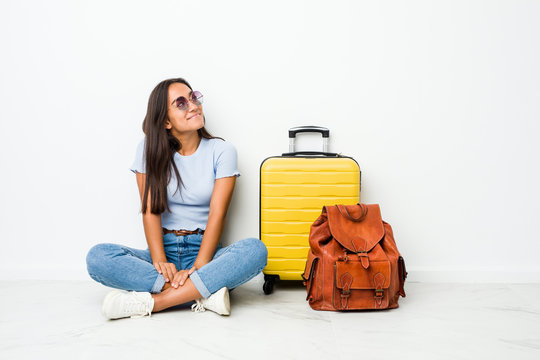 Young mixed race indian woman ready to go to travel dreaming of achieving goals and purposes