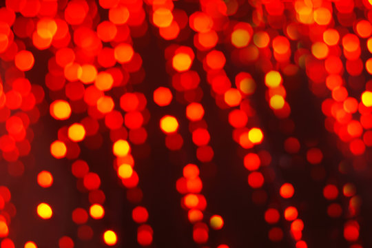 Abstract festive background of red blurry garland lights