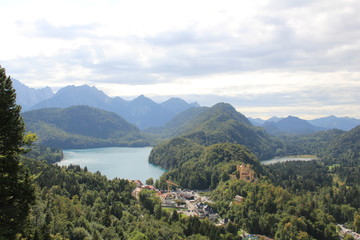 Fototapeta na wymiar mountain village with castle on lake