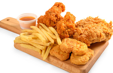Naklejka premium Fried chicken nuggets and french fries isolated on white background.