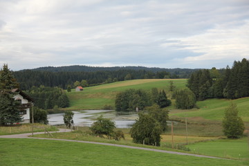 Fototapeta na wymiar green hills with lake
