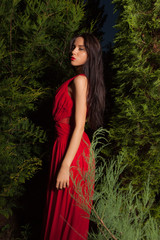 Naklejka premium Portrait of beautiful young girl in summer garden.