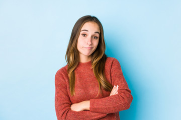 Young caucasian woman posing isolated  unhappy looking in camera with sarcastic expression.
