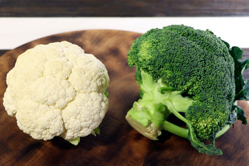 Fresh broccoli and cauliflower on a cutting board. Healthy food. Vegetables.