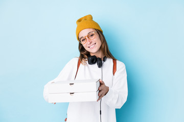 Young caucasian student woman holding pizzas