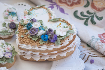 Heart shaped cookies decorated with royal icing glaze and flowers