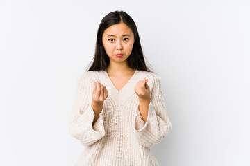 Young chinese woman isolated showing that she has no money.