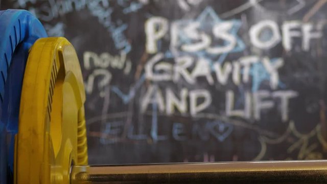 weightlifting mentality concept, motivational concepts written on gym wall