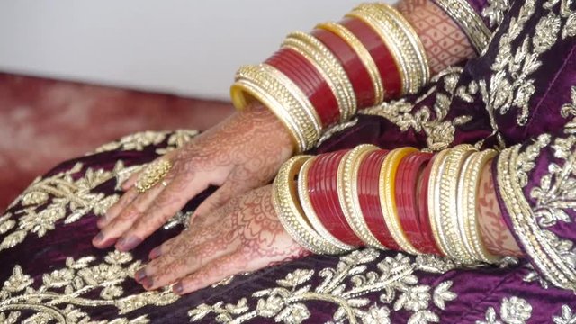 shot of golden bangles for an Indian wedding