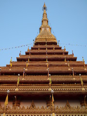 Wat Nong Wang in Khon Kaen Essan Thailand a temple with 9 golden levels and Payanak surrounding the exterior