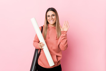 Young woman studying architecture smiling cheerful showing number five with fingers.