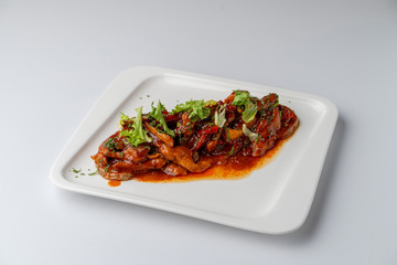 Chinese sweet and sour chicken without rice isolated on white background