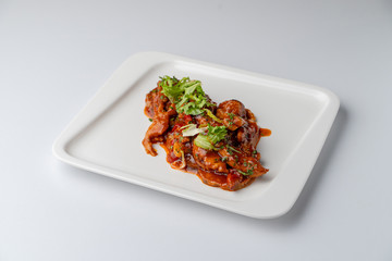 Chinese sweet and sour chicken without rice isolated on white background