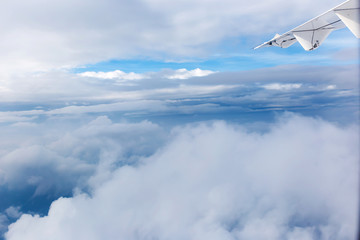 clouds and blue sky seen from plane