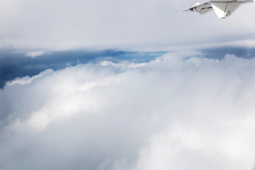 Naklejka na ściany i meble clouds and blue sky seen from plane