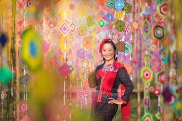 Portrait asian woman in traditional dress at Tung festival.