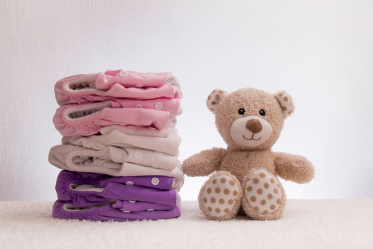  stack of ecological diapers with a teddy bear