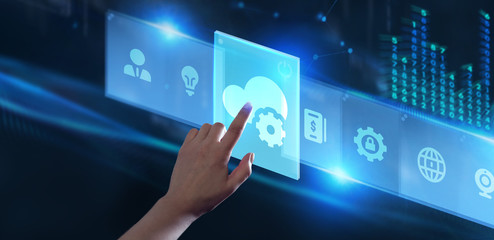 Cloud computing concept. Business, technology, internet and networking concept. Young businessman select the icon Cloud on the virtual display.