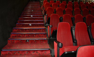 Comfortable red chairs in a movie theater