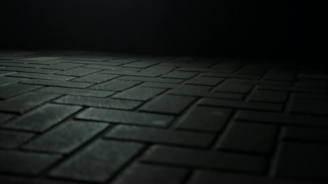 A men&acute;s feet passing in front of the camera.