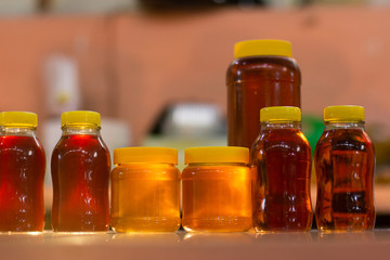 Several bottles of delicious honey being sold at mexican market