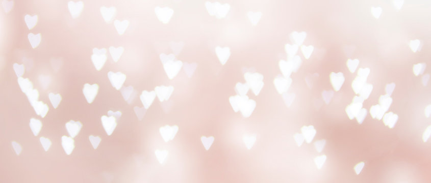 pink background of unfocused hearts