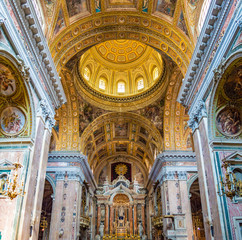 Fototapeta na wymiar Naples, Italy - CIRCA 2013: The interior and dome of Gesù Nuovo (New Jesus).
