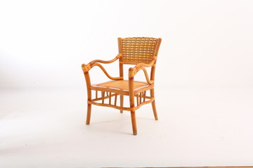 In some Asian countries and China, craftsmen use cane or wicker furniture on a white background. It...