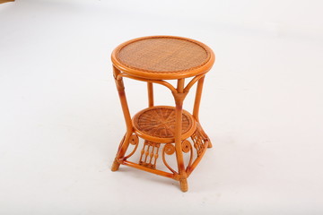 In some Asian countries and China, craftsmen use cane or wicker furniture on a white background. It...