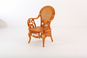 In some Asian countries and China, craftsmen use cane or wicker furniture on a white background. It...