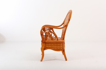 In some Asian countries and China, craftsmen use cane or wicker furniture on a white background. It...