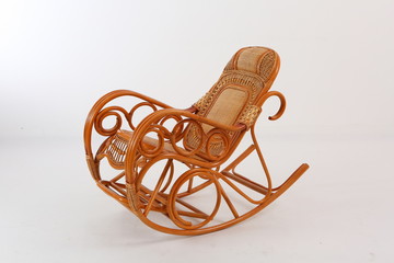 In some Asian countries and China, craftsmen use cane or wicker furniture on a white background. It...