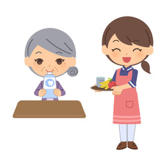 認知症女性に別の食べ物を差し入れる女介護士