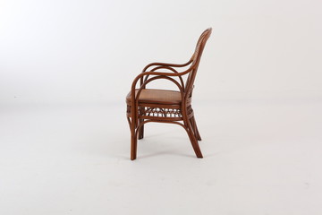 In some Asian countries and China, craftsmen use cane or wicker furniture on a white background. It...