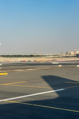 Dubai Emirates, a large air plane on a runway at an airport