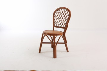 In some Asian countries and China, craftsmen use cane or wicker furniture on a white background. It...