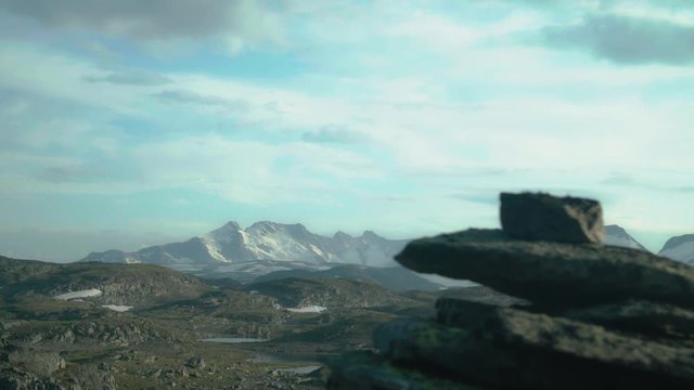 cinematic shot of a mauntain range in norway, sognefjellet midsummer