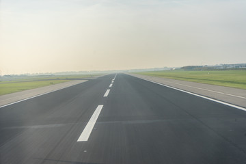 Amsterdam Schiphol,, a highway with cars parked on the side of a road airport runway