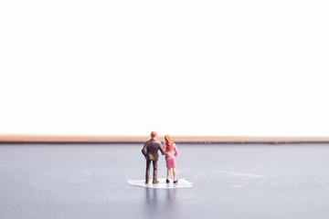 A miniature of young couple on blackboard for future and planning concept.