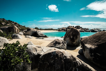 The Baths in Virgin Gorda BVI with rock formations that are beautifully complimented with the blue water surrounding them. 