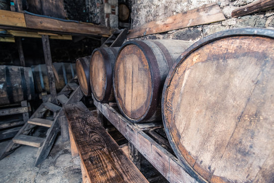 Cane Garden Bay Tortola BVI's Callwood Rum Distillery equipment. Rum sitting in barrels, stocked for tapping. 