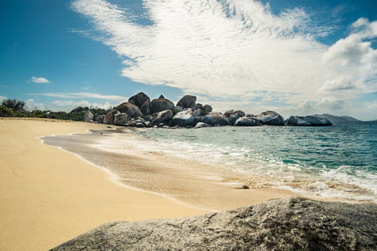 The Baths in Virgin Gorda BVI with rock formations that are beautifully complimented with the blue water surrounding them. 