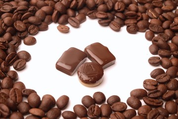 coffee beans and sweet on white background with copy space for text