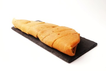 Apam balik on slate plate isolated on white background