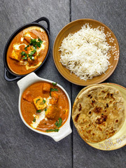 Top down view of Paneer Butter Masala , a rich and creamy Indian dish made of Paneer or Tofu in tomato and cream gravy.