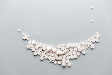 smiling face made of pills, copy space for text.